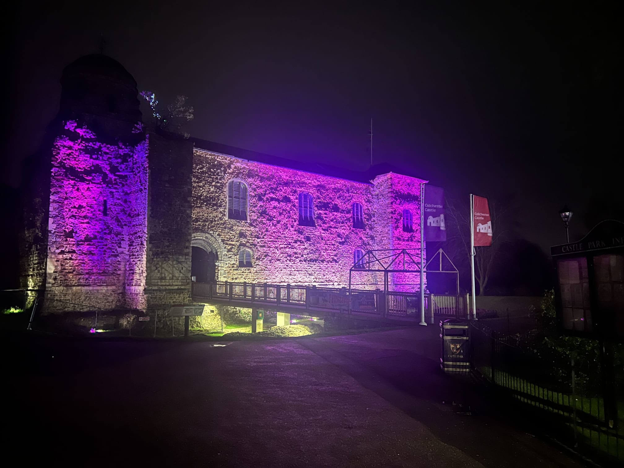 Colchester Castle lit purple and pink
